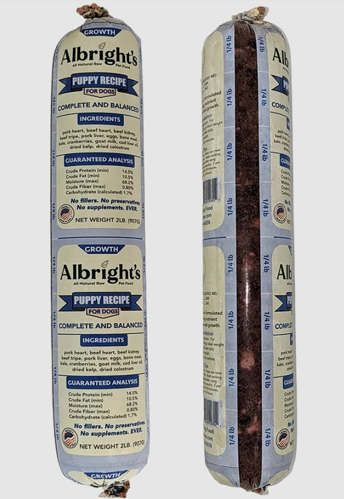 Two packages of Albright's Puppy Recipe for dogs on a white background