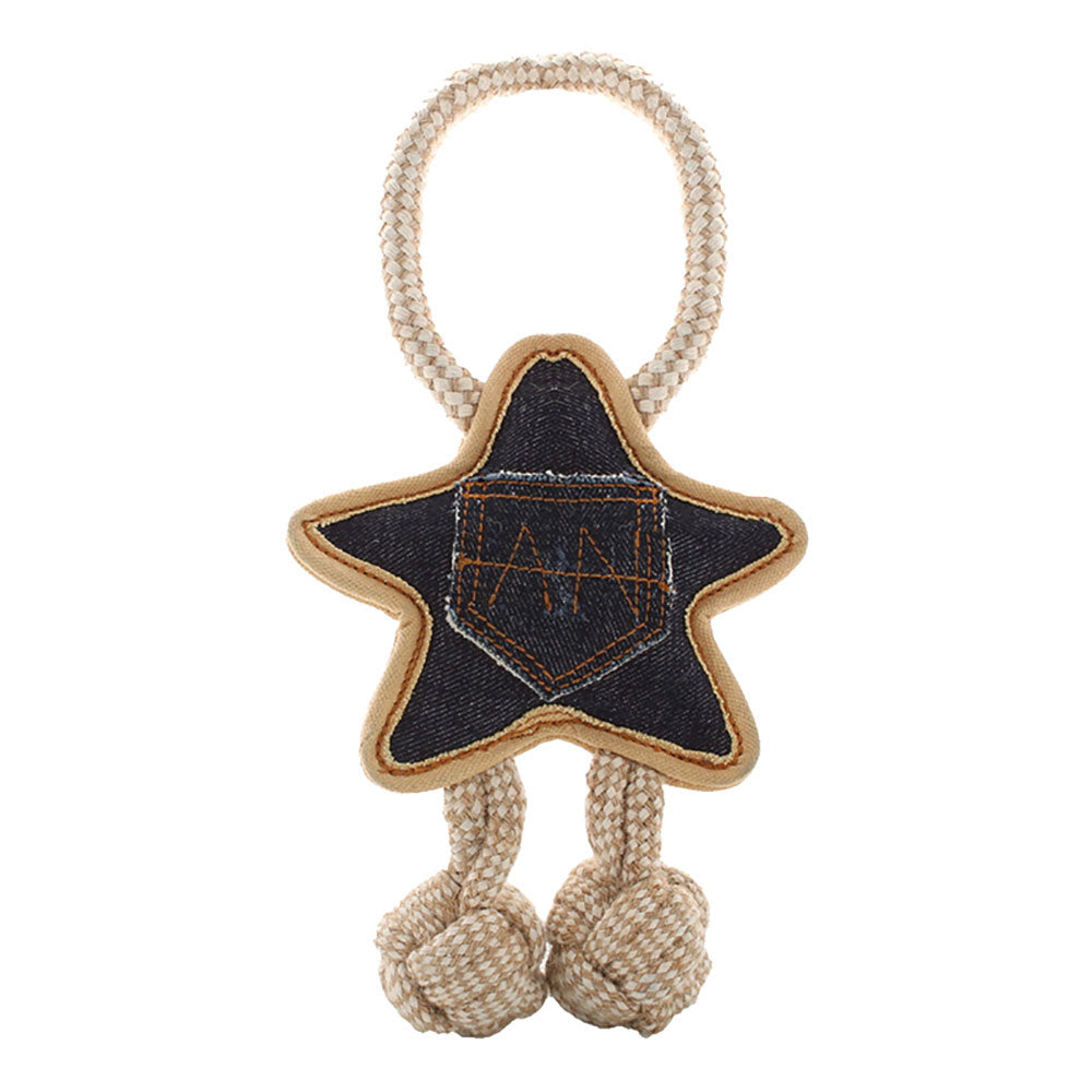 Star-shaped dog toy with denim patch and knotted ropes on a white background