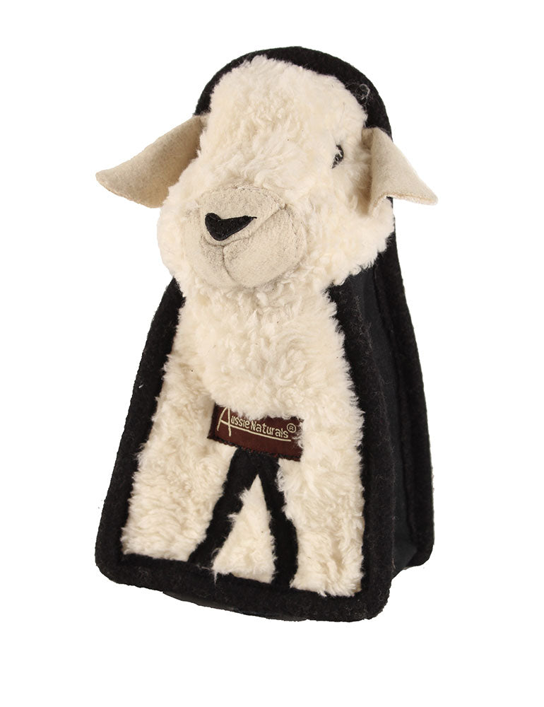 Sheep-shaped toy with a black fleece blanket on a white background